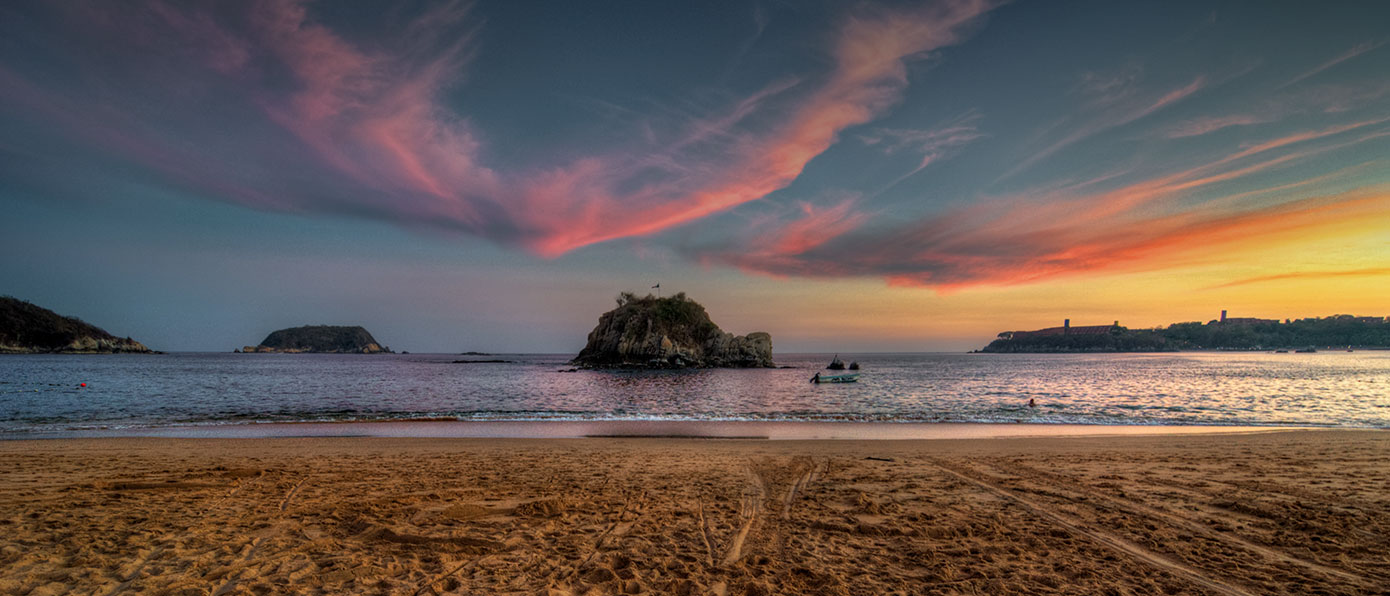 hotel bahia huatulco atardecer playa tour